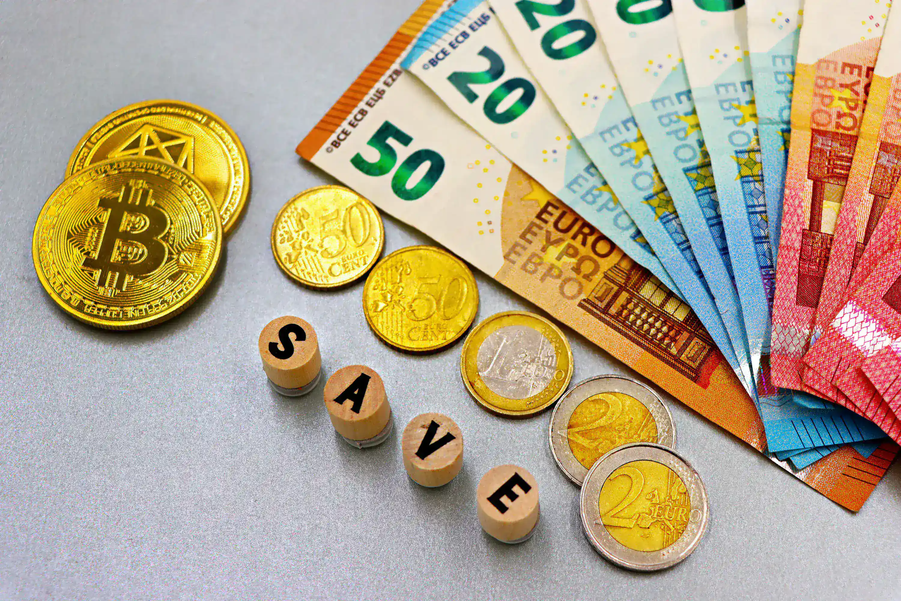 Digital assets and multiple currencies arranged beside market symbols