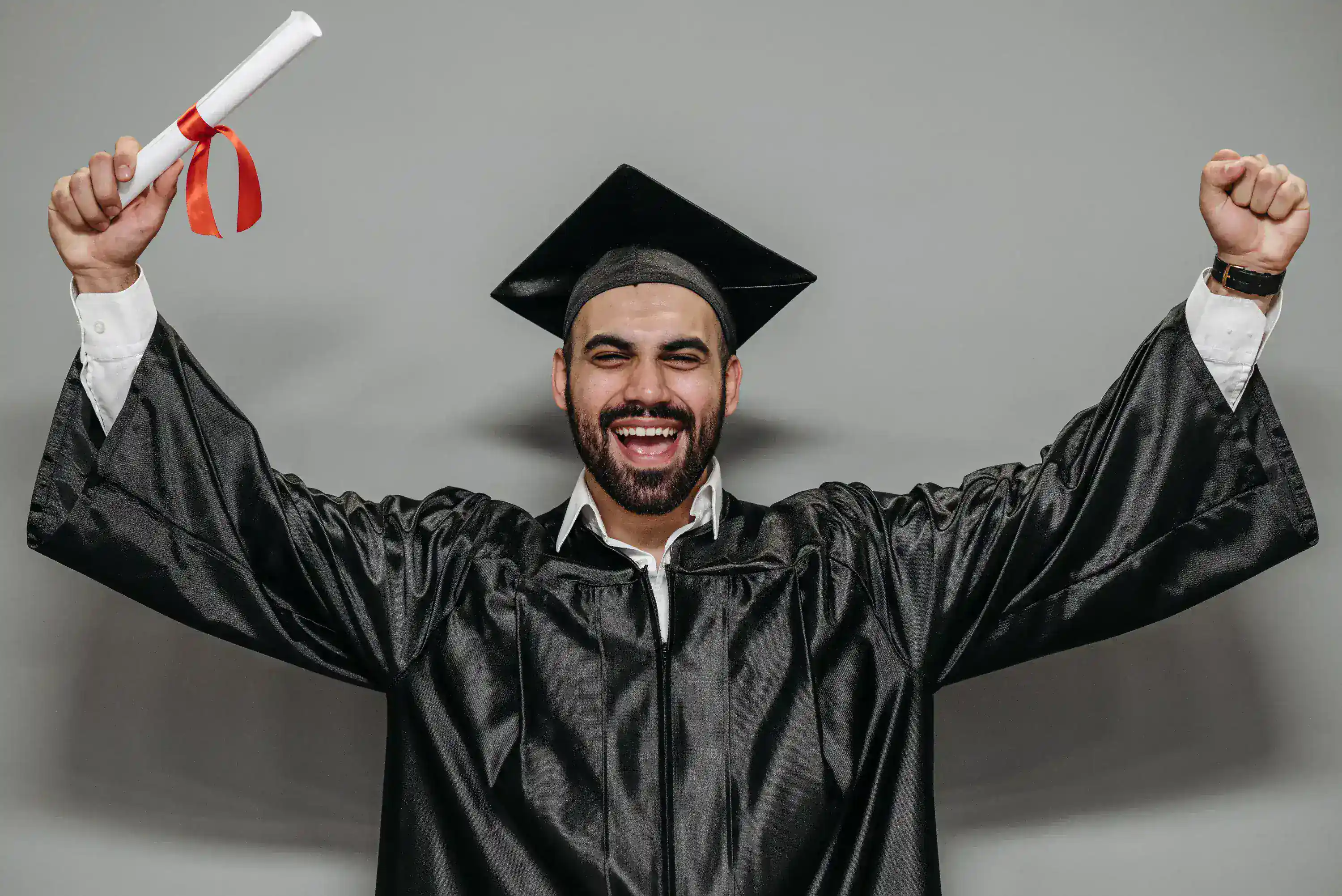 Graduate holding a diploma after completing higher education
