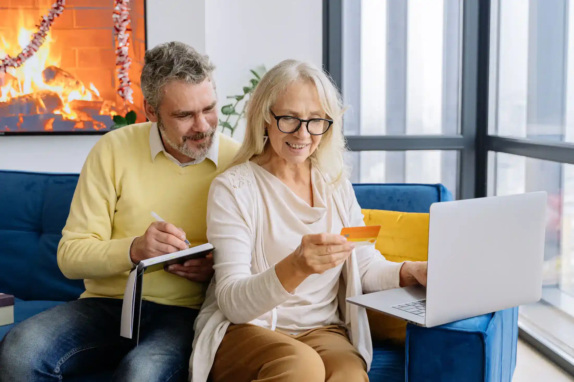 Retired couple reviewing finances together at home