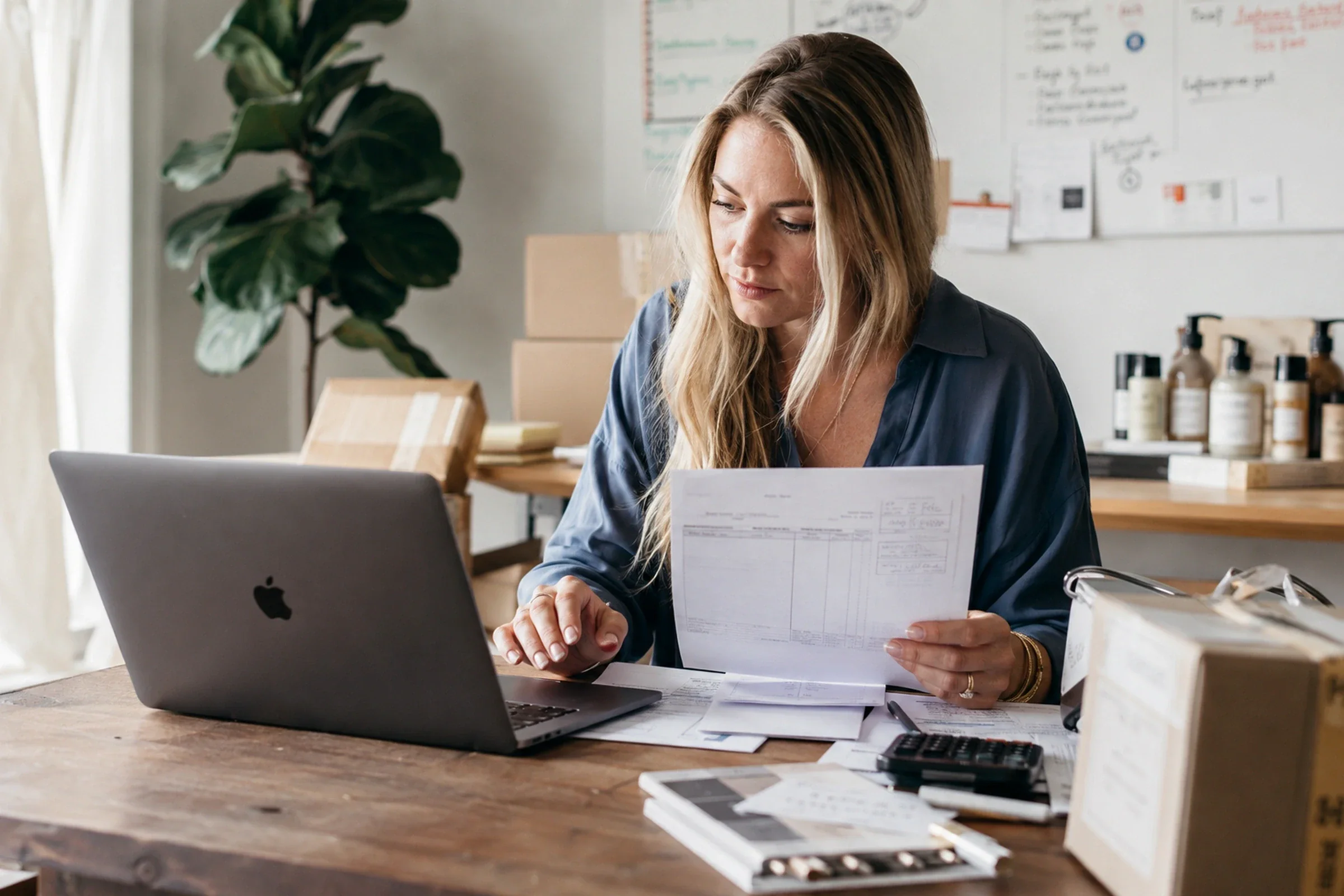 Small-business professional reviewing finances on a tablet